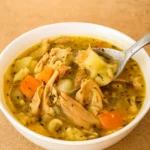 Anti-Inflammatory Chicken Soup in a rustic bowl