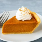 Black Folks Sweet Potato Pie freshly baked on wooden table
