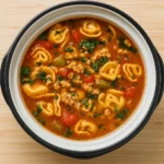Slow Cooker Tortellini Soup in a rustic bowl