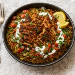One Pot Chicken Shawarma Rice in a pot with garnish
