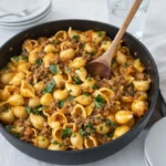 One Pot Creamy Beef and Shells in a skillet with creamy sauce
