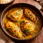 Crockpot Thai Peanut Chicken served over rice with peanuts