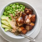 Air Fried Teriyaki Salmon Bites Rice Bowl served with avocado and edamame