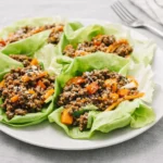 Asian-Style Ground Beef Lettuce Wraps with sesame garnish