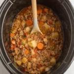 Crock Pot Poor Man’s Stew served in a rustic bowl