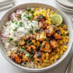 Delicious Street Corn Chicken Bowl on rustic table