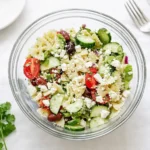 Greek Pasta Salad served in a rustic bowl