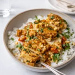 Slow Cooker Peanut Chicken served with rice
