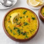 Vegan Lemon Lentil Soup with Turmeric served hot with lemon